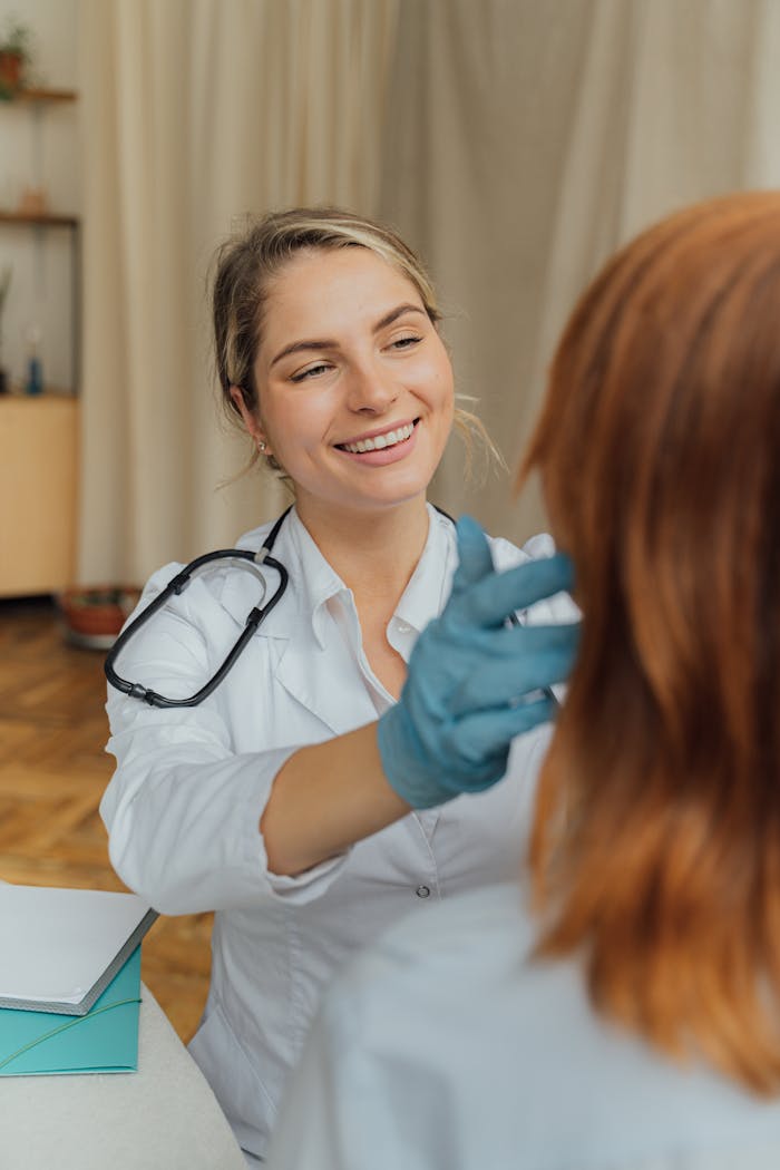 About A cheerful healthcare professional examining a patient indoors, promoting positive healthcare experiences.